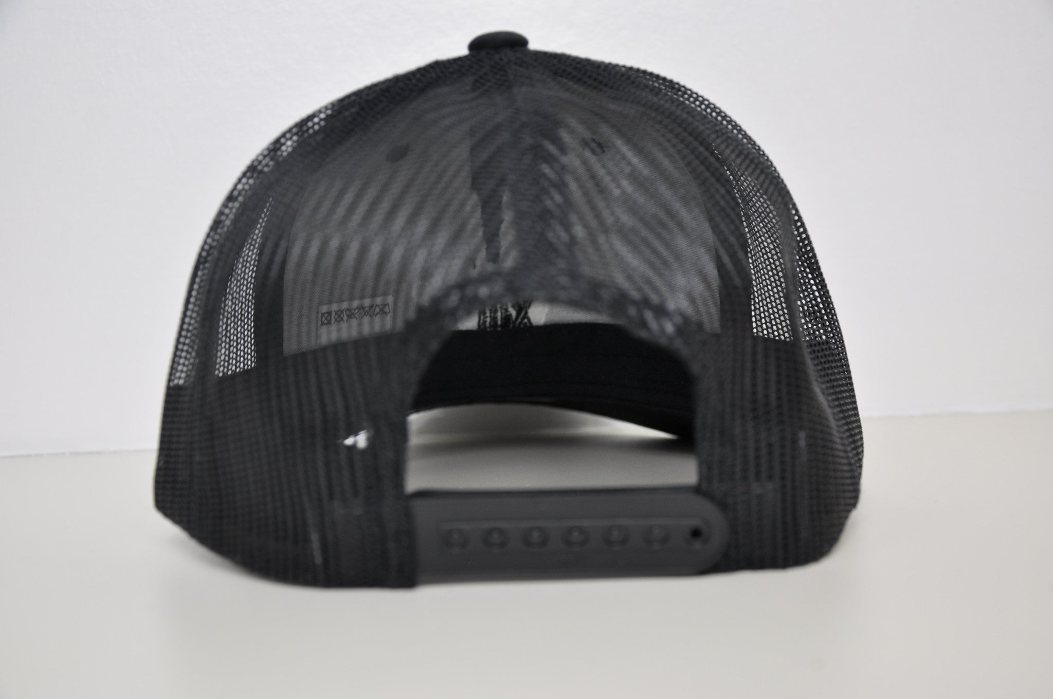 Black retro trucker X White logo